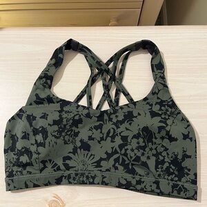 Lulu Lemon sports bra, size L, black and green floral pattern.